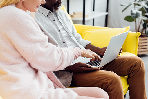 Couple Attending Online Christian Counseling Using Their Laptop