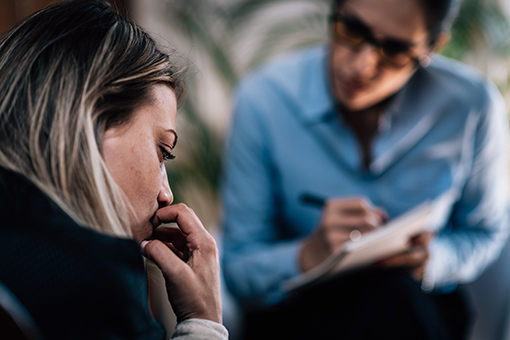 Lady Undergoing Divorce Zoning Out While Talking to Christian Counselor