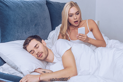 Gainesville Wife Looking at Sleeping Husband's Phone In Need of Christian Marriage Counseling