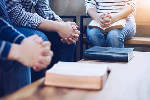 Christian Couple and Marriage Counselor Praying Before First Session That is Not Online