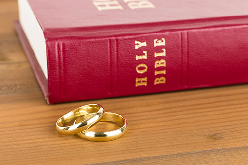 Bible and Wedding Bands of Couple Looking for Florida-based Marriage Counselor