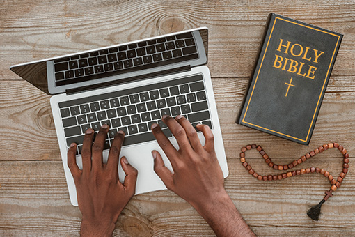 Bible and Laptop of Christian Man Looking for Divorce Counseling